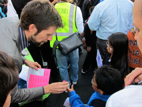 Nick Kaestner, SFUSD Director of Sustainability, handing out stickers to kids who walked to school on Wednesday. Photo: Matthew Roth