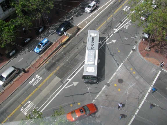 Extending the green bike lane back to the crosswalk is completed by the fact that 11th Street is used by transit, and has tracks where the historic streetcars often pull off. The bike lane could probably not be protected for these reasons, or could it?