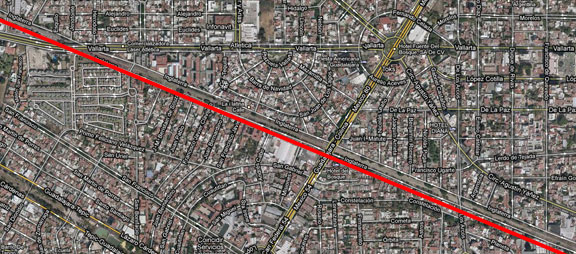 Avenida Inglaterra is just above the red line crossing the image; it is currently a rail corridor with utility lines and limited open space on either side.