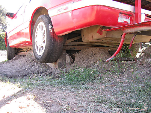 Heavy cement was moved by a guy passing by serendipitously on a big backhoe!