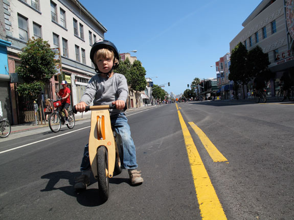 A child riding a balance bike during Sunday Streets in 2009. Photo: Matthew Roth