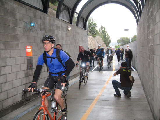 Some of the first cyclists to ride through the tunnel after the ceremonial opening. Photos: Tom Murphy