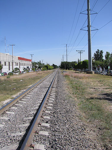 This is the current situation along much of the line. Train tracks down the middle. High tension electric lines on the right, underground gas and oil pipelines under the left.