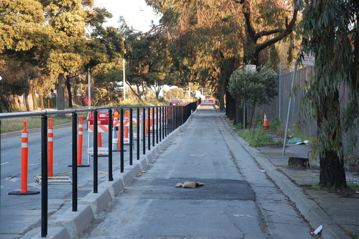 San Francisco's first protected bike lane under construction in 2012 on Cargo Way. Image: Streetsblog SF