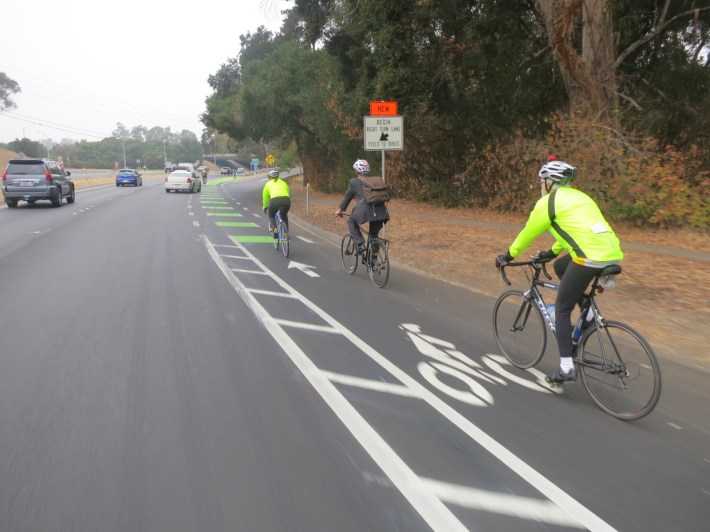 Cyclists travel north on Alpine Road in the new green and buffered bike lanes at Highway 280. Photo: Andrew Boone