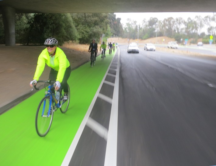 Menlo Park City Council Member Kirsten Keith enjoys the new green and buffered bike lane at Alpine Road and Highway 280. Photo: Andrew Boone