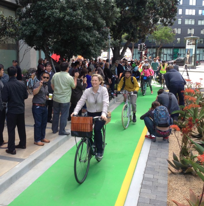 Cheryl Brinkman, Vice Chair to SFMTA's Board of Directors, rides the new bikeway for the first time. Photo: Stan Parkford.