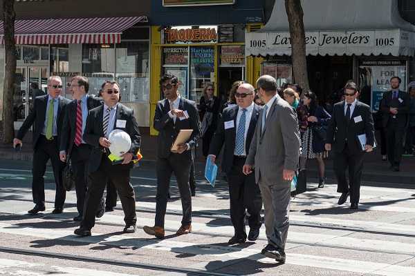 SFMTA Director Ed Reiskin leads state and national transportation officials on a tour today at deadly Market and Sixth Streets. Photo: SFMTA