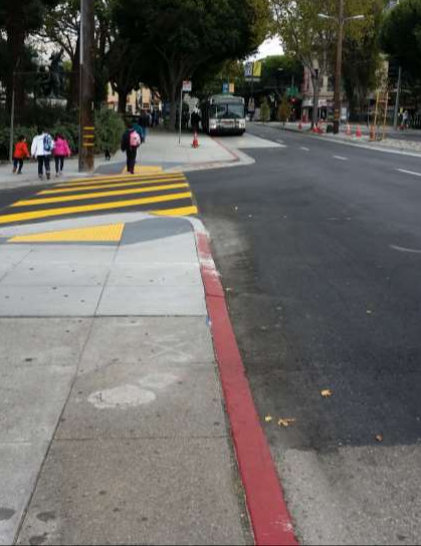 A sidewalk extension on Columbus Avenue at Washington Square Park. One man complained yesterday that "there should be a warning saying that you are now much closer" to motor traffic. Photo: SFMTA