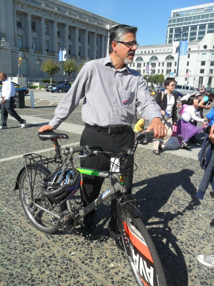 John Avalos and his bike during a campaign event