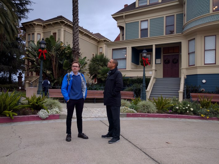 Andrew Faulkner and Jonathan Fearn in Preservation Park. These few Victorian homes are all that remains of a once great neighborhood destroyed by the 980.