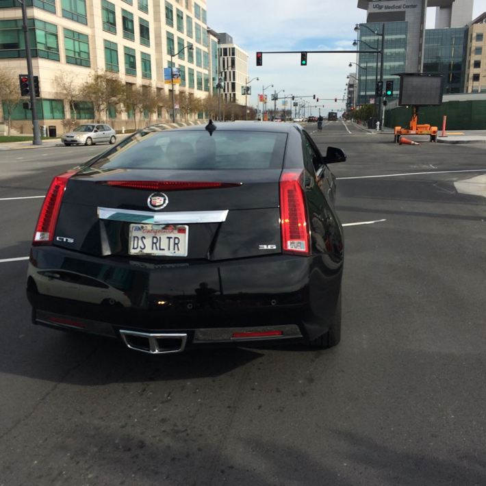The driver of this Cadillac allegedly buzzed and pepper sprayed a cyclist Tuesday. Photo: Danica Helb