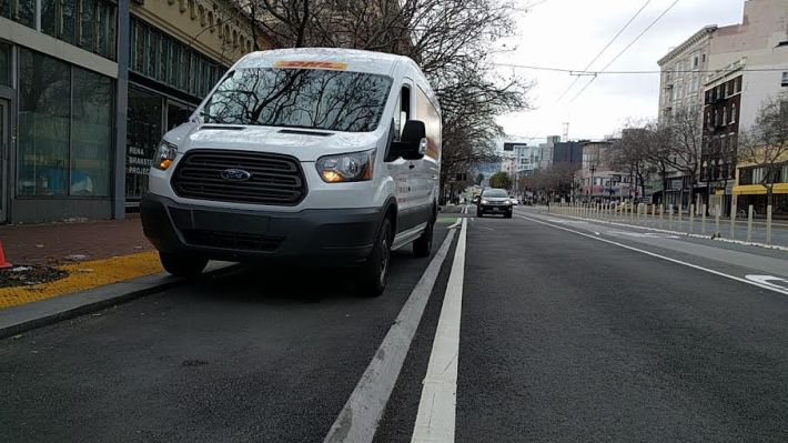 Delivery truck blocking a raised bike lane on Market. Photo: Roger Rudick