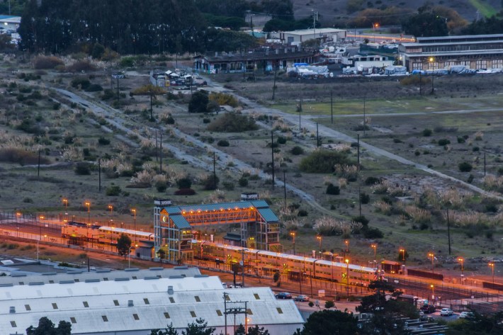 In the middle of a housing crisis, the land adjacent to a Caltrain station only ten minutes out sits fallow. Image: Wikimedia Commons.