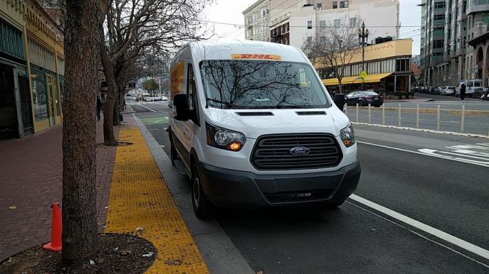 DHL truck parked on raised Market Street Bike Lane. Photo: Roger Rudick