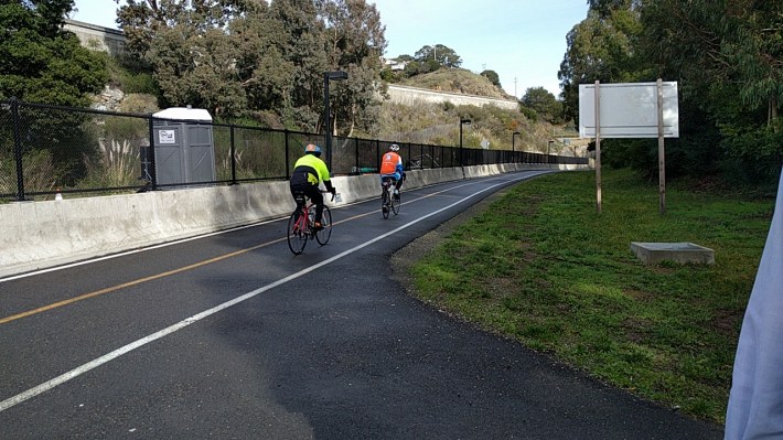 Although it will be another __ until the train reaches Larkspur, the adjacent bike path is open now.