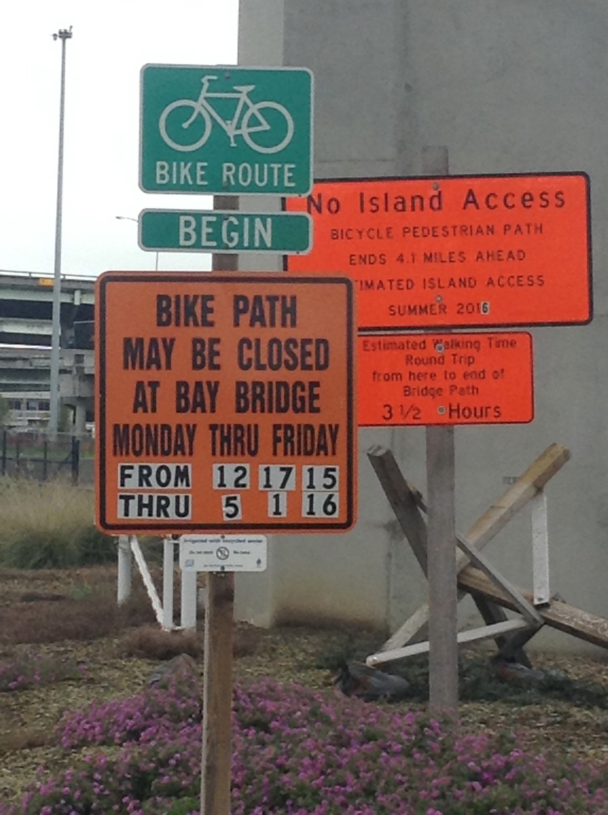 Old signs warn that the bridge path may be closed on weekdays; they haven't been updated to reflect Caltrans' recent announcement.