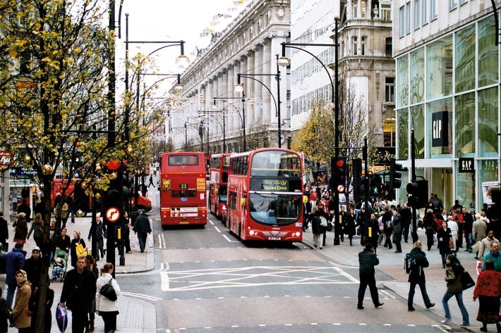 Oxford Street is one of the busiest, most successful retail streets on the planet, yet it has no parking and transit rules the street. Image: Wikimedia Commons.