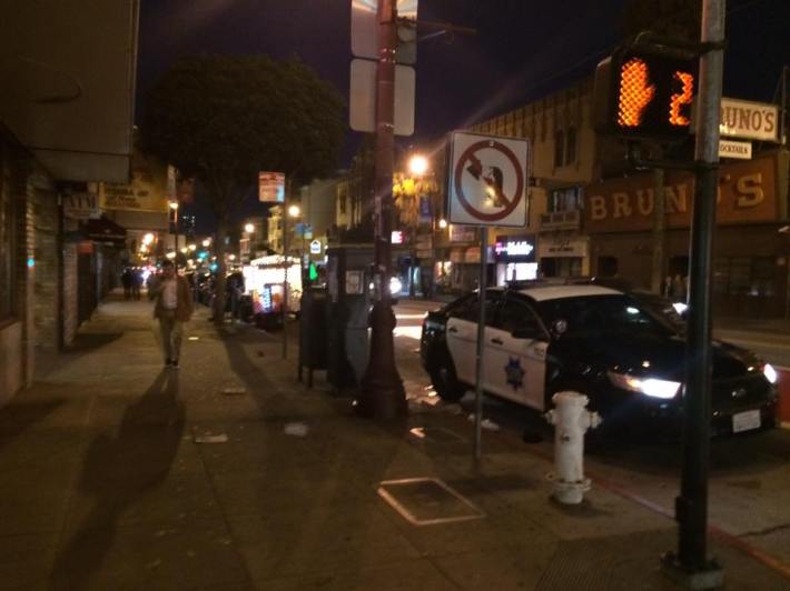 The perp/suspect is in the back of the SFPD car. Photo: Solis.