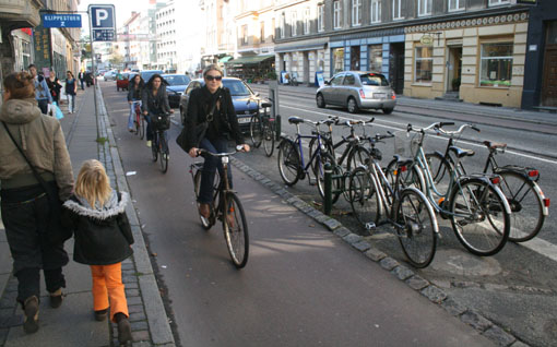 A raised, parking protected bike lane allowing San Francisco cyclists to ride in serenity. Just kidding. That's Denmark. Photo: Streetsblog.