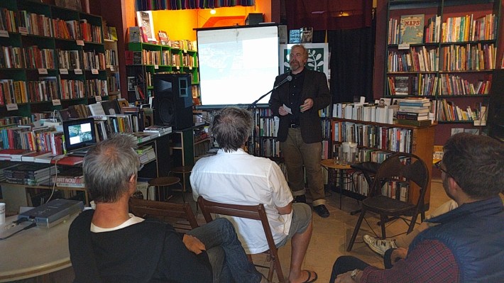 Jason Henderson talks about his new book, co-written with Nicole Foletta, about designing car-free and car-lite cities, at Green Arcade Books. Photo: Streetsblog