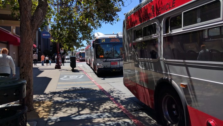 One thing the transit lanes doesn't seem to have improved on: bus bunching. Three 14s in a row pulled into the stop on 22nd. Photo: Streetsblog.