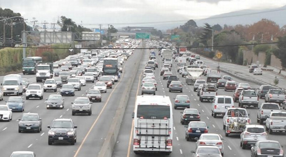 Buses stuck in traffic on today's Highway 101 in San Mateo County. Planners hope to move more people in fewer vehicles by installing express lanes. Photo: TransForm