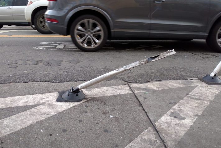 This old, worn out and damaged post was on the opposite side of 15th from SFMTrA's installation. SFMTA has time to remove new posts that aren't authorized, but no time to fix their own busted post. Photo: Streetsblog