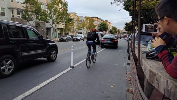The Uber driver still blocked the bike lane, but had to pull past the end of the row of SFMTrA safe-hit posts. Photo: Streetsblog