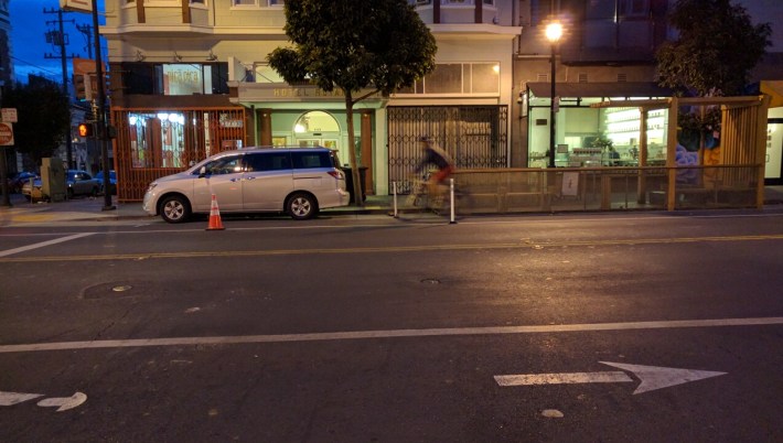 A lone, pre-dawn cyclist enjoying the safety additions on Valencia. Photo: Streetsblog