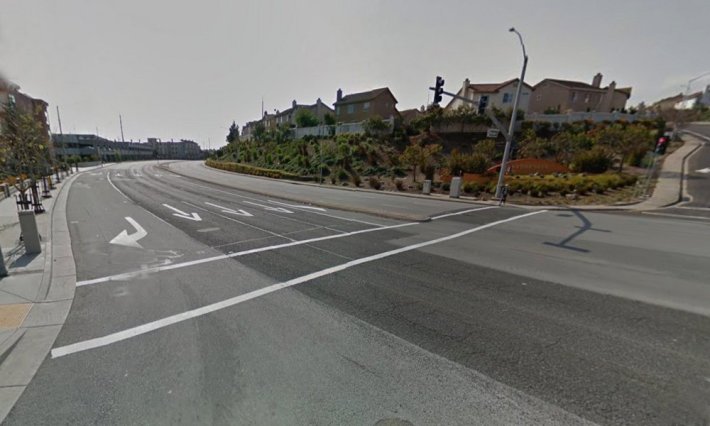 Pedestrians face a crossing distance of 110 feet and eight traffic lanes to cross El Camino Real at McClellan Drive, and are banned from crossing on the intersection's west side (not shown). Photo: Google Maps