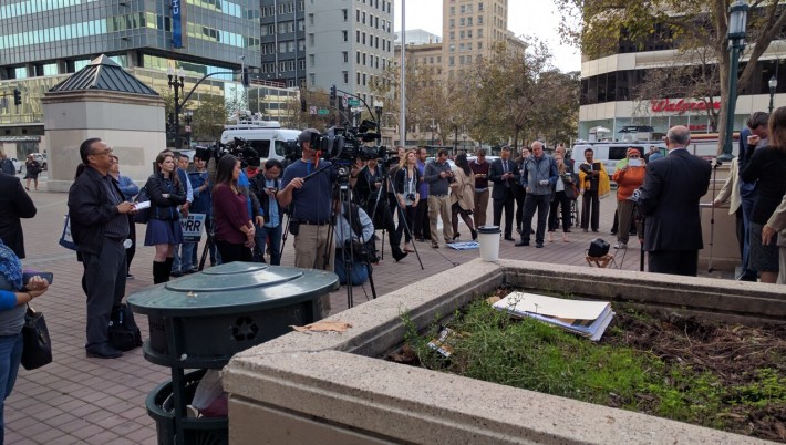 The press gaggle watched from Frank H. Ogawa Plaza, in front of Oakland City Hall. Photo: Streetsblog