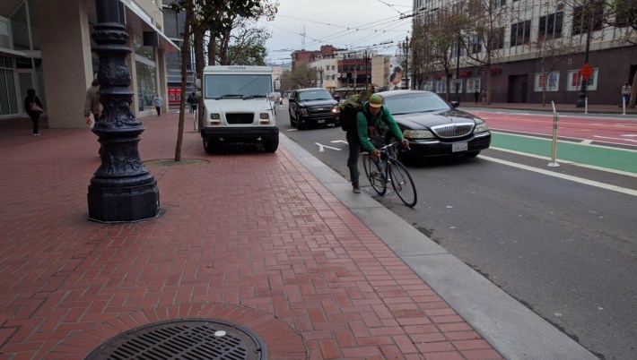 If trucks are willing to park on the sidewalk, clearly a raised bike lane needs more than a curb. Photo: Streetsblog