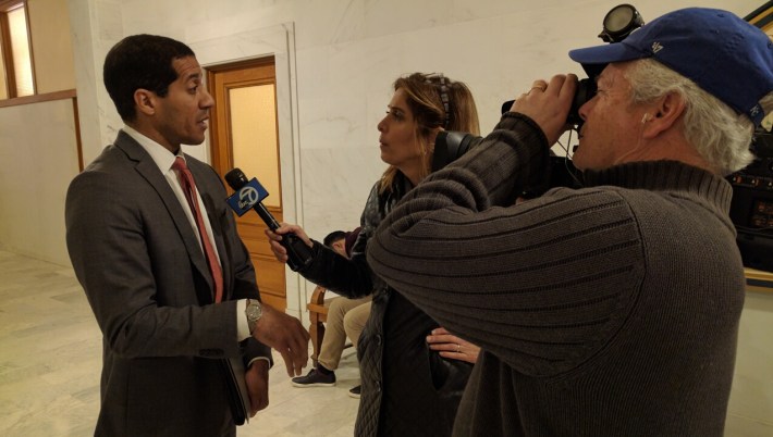 CTA spokesman Eric Young doing an interview outside the hearing room with ABC. Photo: Streetsblog