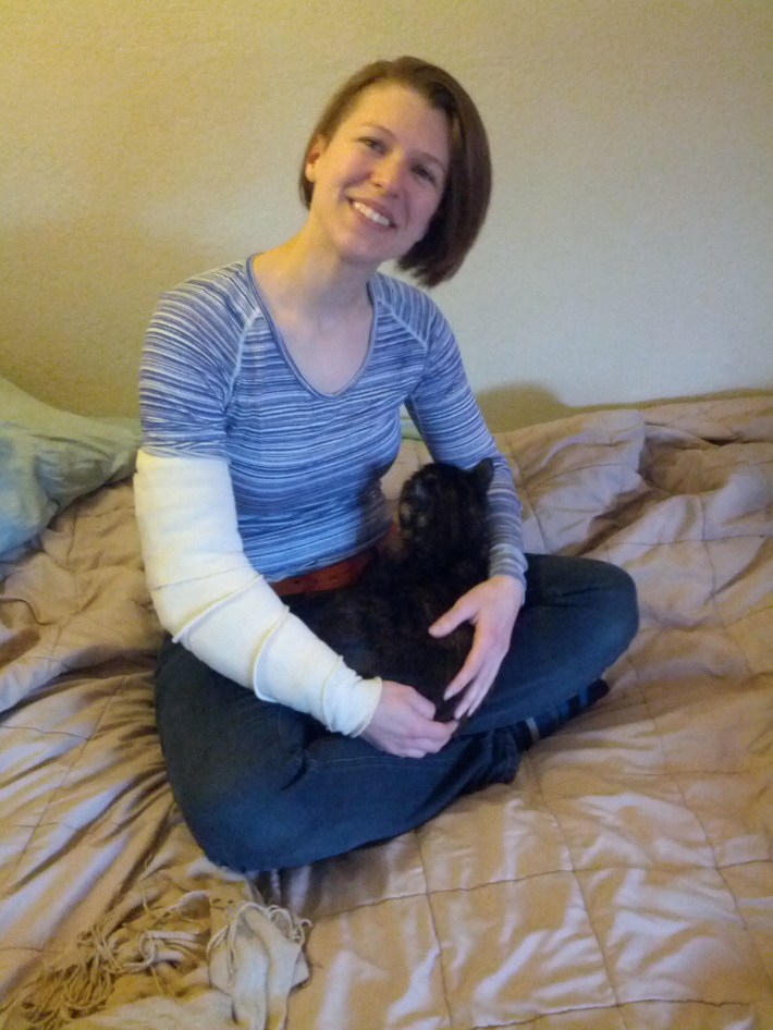 Lauren Sailor, relaxing at home with her cat.