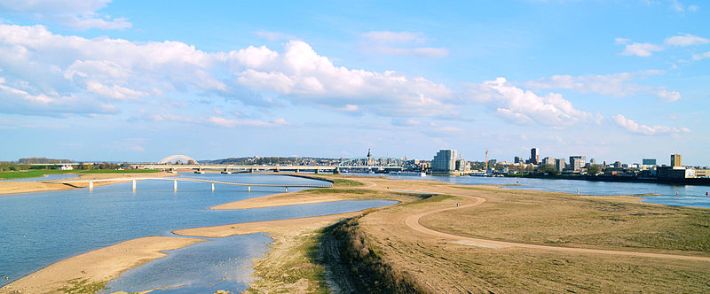 The Dutch city of Nijmegen diverted a river, created an island, and built new bridges to divert water, protect the city, and create new public spaces. Image: Wikimedia