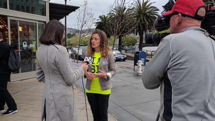 Walk San Francisco's outgoing executive director, Nicole Ferrara, giving a television interview at the start of the walk. Photo: Streetsblog/Rudick
