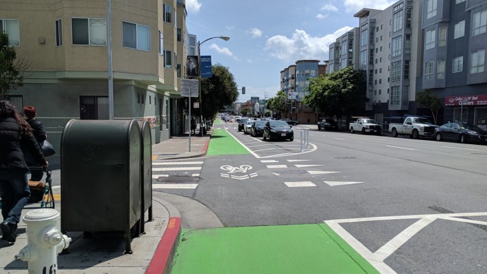 A long stretch of 7th Street's parking protected bike lane is now open for business.