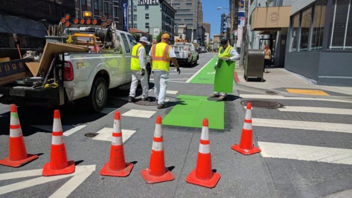 An SFMTA crew putting down some green thermoplastic at an intersection on the new bike lane on 7th late Tuesday morning. Photo: Streetsblog/Rudick
