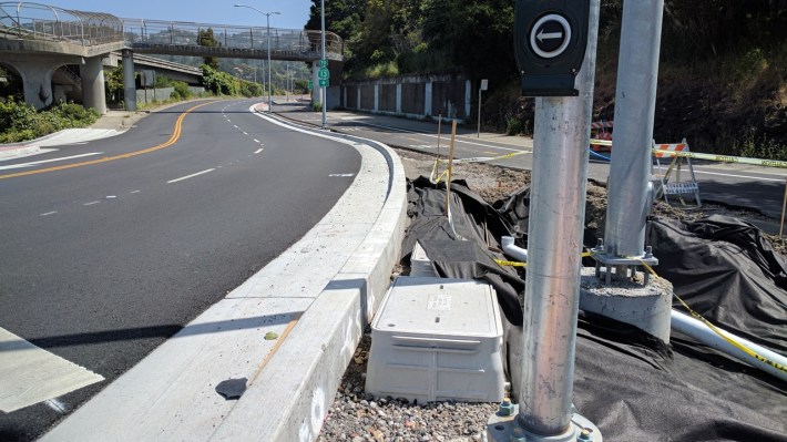 A real curb and a substantial buffer keeps cyclists and pedestrians safe from fast-moving cars and trucks getting on and off SR24.