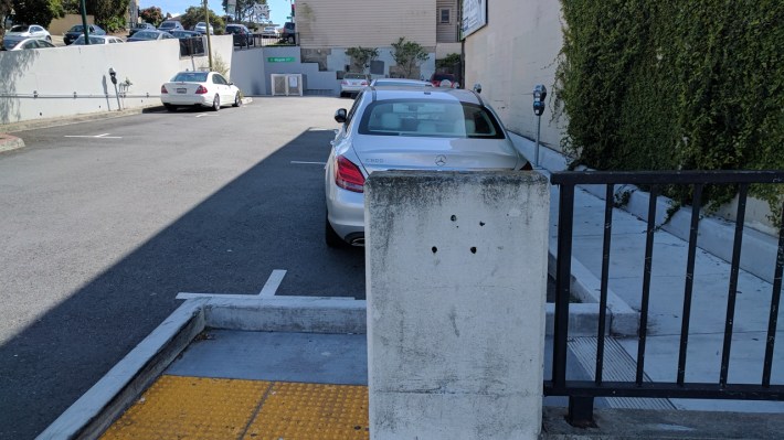 The lockers are, technically, visible from the entrance of the parking lot. Photo: Streetsblog/Rudick