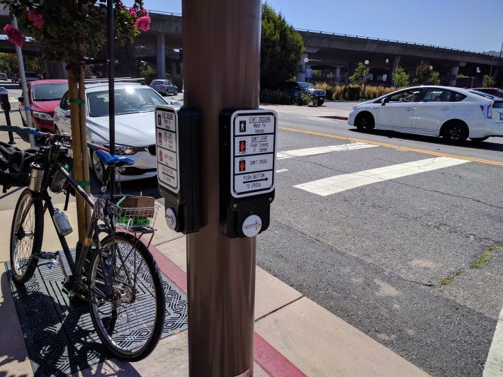 Getting from the transit center to the station platforms is a maze of beg buttons and fencing. Photo: Streetsblog/Rudick