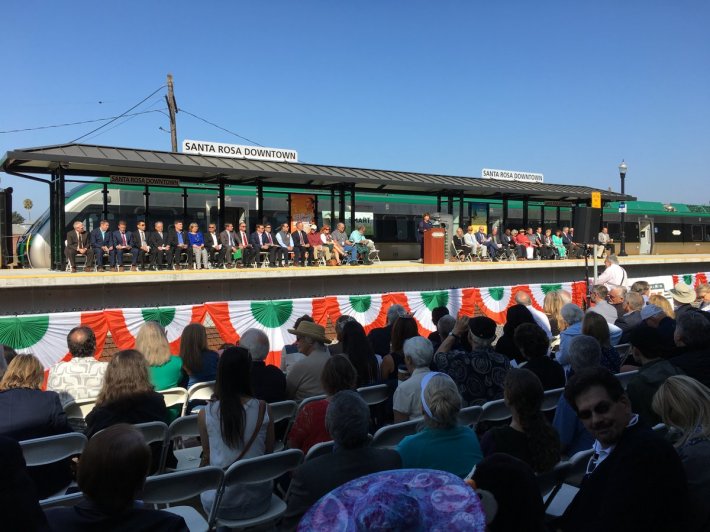 While people waited for trains that were not coming until 2:29, the management of SMART celebrated the opening of the system that wasn't yet really open, up in Santa Rosa. Photo: SMART