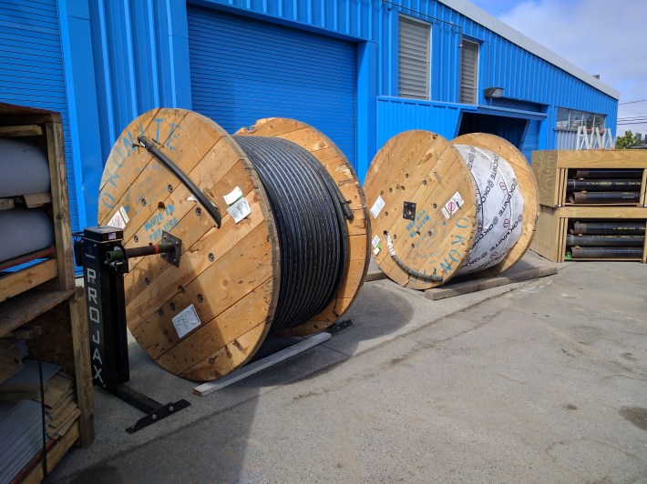 Spools of high voltage conduit at BART's Oakland facility. This wire will be installed over the Labor Day weekend. Photo: Streetsblog/Rudick