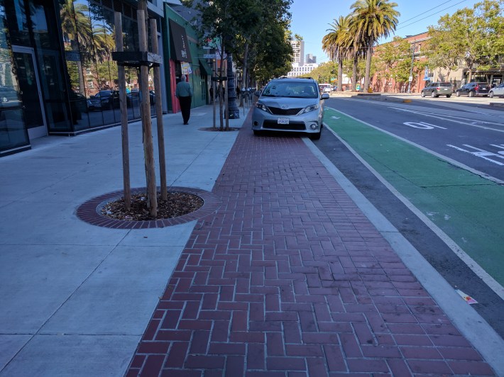 Cars park on bike lanes. Cars park on sidewalks. The new bike lanes are going to need physical enforcement. Photo: Streetsblog/Rudick
