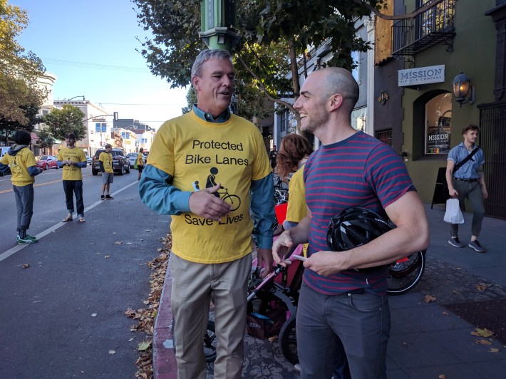 Supervisor Jeff Sheehy talks with Bike Coalition Director Brian Weidenmier at yesterday's protest for protected bike lanes on Valencia