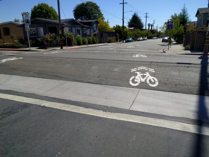 California street looking south across Dwight in its current configuration. There are sharrows, but since cross traffic has no stop sign, the configuration makes it unclear who has the right of way. Photo: Streetsblog/Rudick