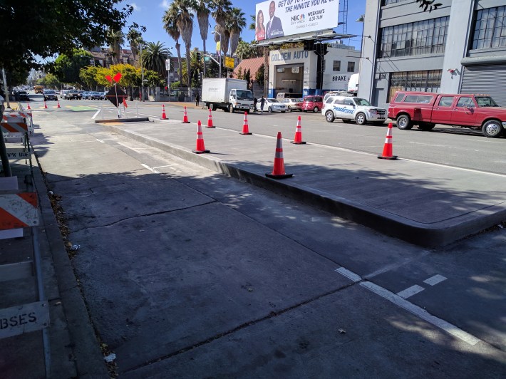 A quick-install bus-boarding island on Folsom near 6th.