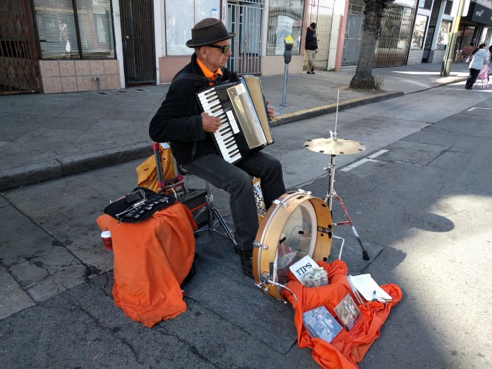 Brian Belknap jamming away during Sunday Streets