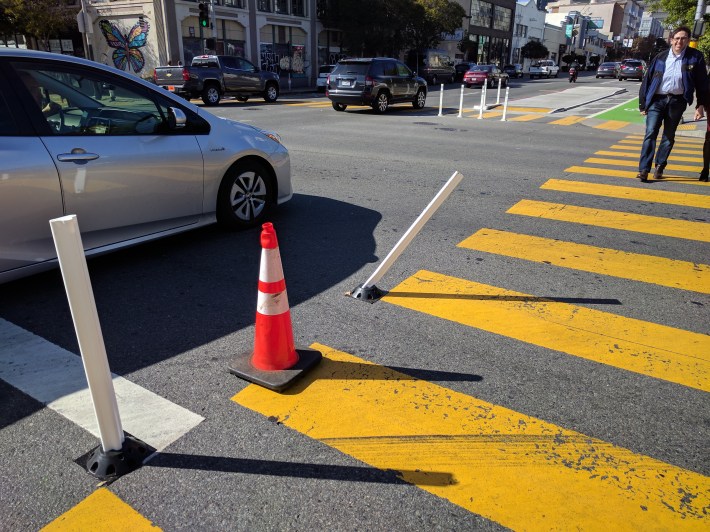 Safe hit posts help guide cars around the curves more slowly--and help prevent motorist from accidentally turning into the bus boarding island.